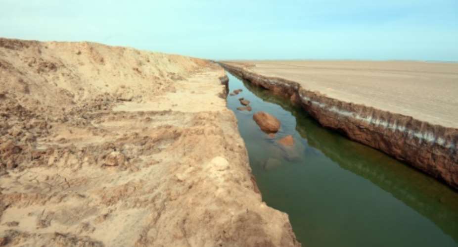 One of the trenches dug along the Libyan border, near the Ras Jedir crossing point on February 6, 2016 that is part of a system of obstacles that stretches some 200 kilometres 124 miles long.  By Fethi Belaid AFP