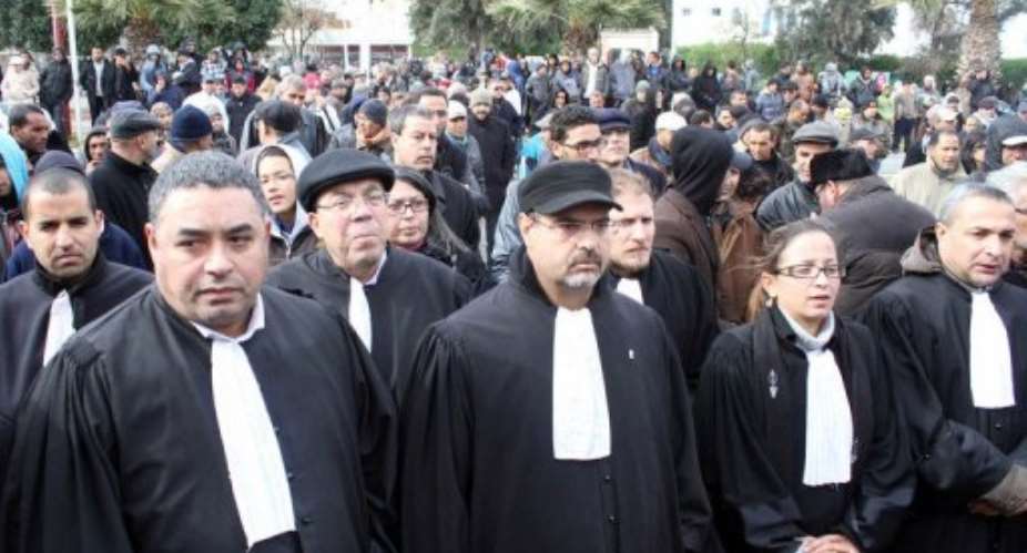 Tunisian people and lawyers demonstrate against the assassination of Chokri Belaid on February 13, 2013.  By Fawzi Dridi (AFP)