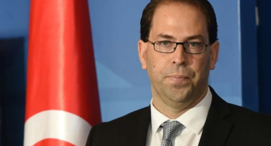 Tunisias newly appointed prime minister-delegate Youssef Chahed speaks to the press at Carthage Palace on the outskirts of Tunis, on August 3, 2016.  By Fethi Belaid (AFP)