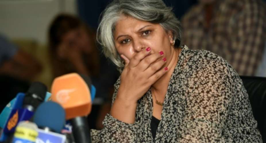 Basma Khalfaoui, the widow of murdered Tunisian opposition figure Chokri Belaid, listens during a press conference in Tunis on October 6, 2015.  By Fethi Belaid AFP