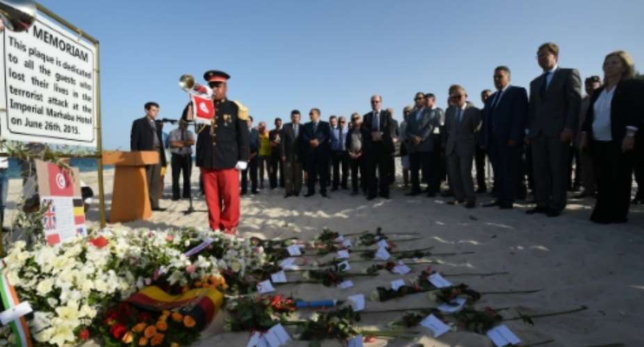 British and Tunisian officials attend a ceremony on June 26, 2016 in memory of those killed a year ago by a jihadist gunman in front of the Riu Imperial Marhaba Hotel on the outskirts of Sousse.  By Fethi Belaid AFPFile