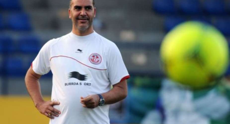 Tunisian coach Sami Trabelsi looks at players during a training session in Bongoville.  By Pius Utomi Ekpei AFPFile