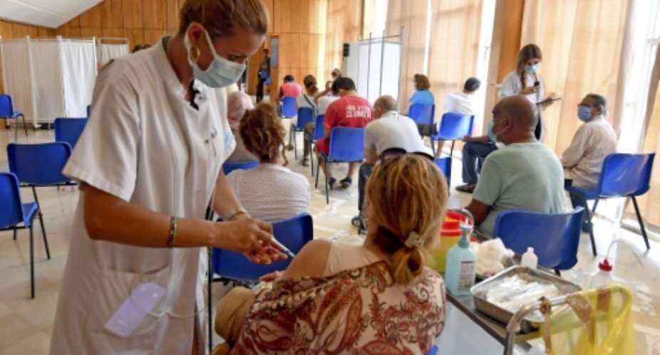 Tunisian health officials credit a rapid mass vaccination campaign with putting the brakes on a surge in Covid infections which overwhelmed hospitals across North Africa over the summer.  By FETHI BELAID AFPFile