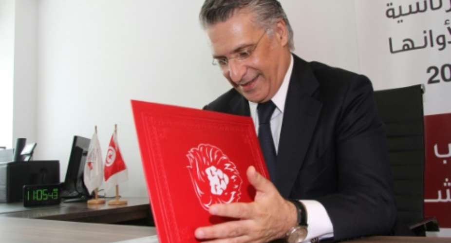 Tunisian media magnate Nabil Karoui submits his candidacy for snap September polls.  By MOHAMED HAMMI AFP