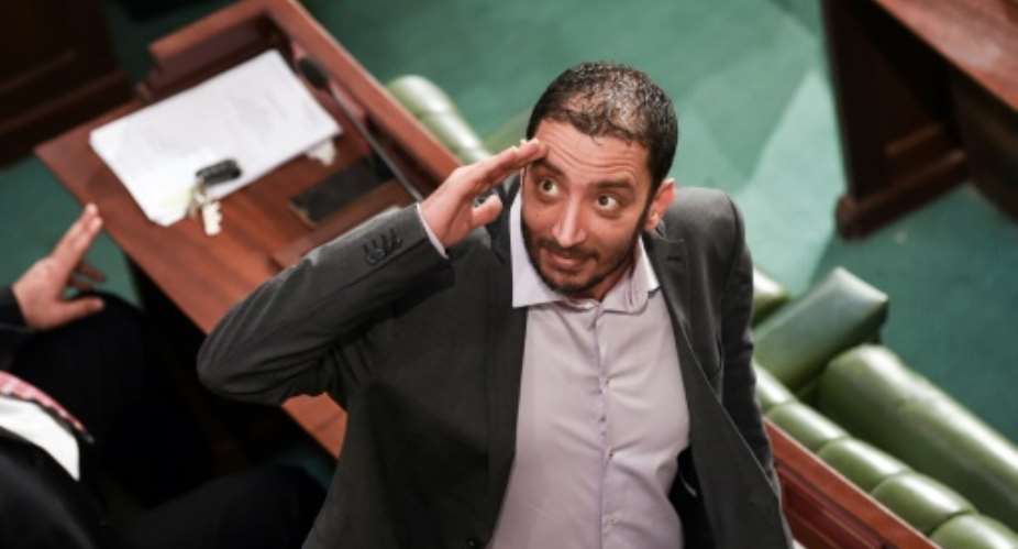 Tunisian parliamentarian Yassine Ayari gestures during a session in the capital Tunis on February 15, 2018 -- his vocal criticism of authorities has brought him many run-ins with the law.  By FETHI BELAID AFPFile