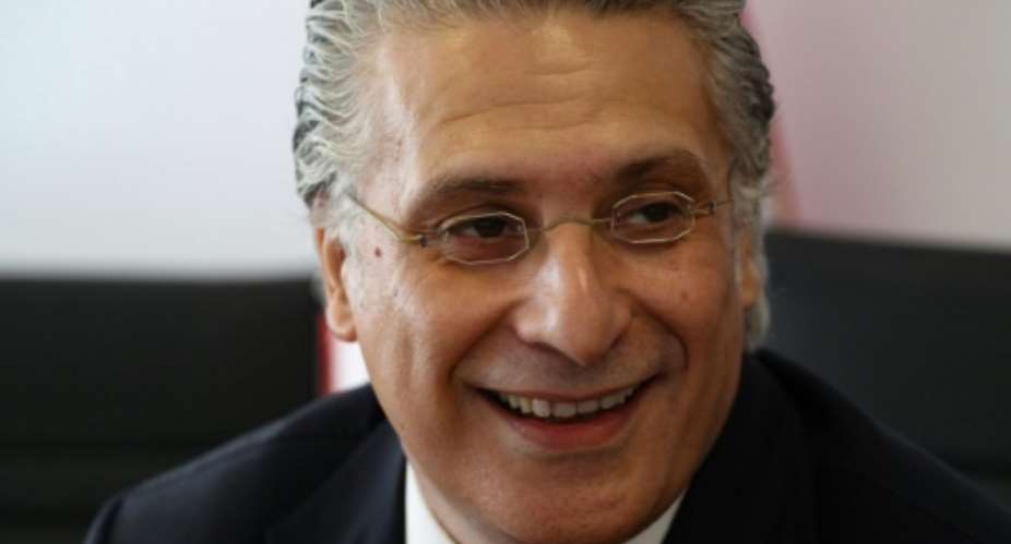 Tunisian presidential candidate Nabil Karoui is continuing his campaign, despite being behind bars on money laundering charges.  By Hasna AFPFile