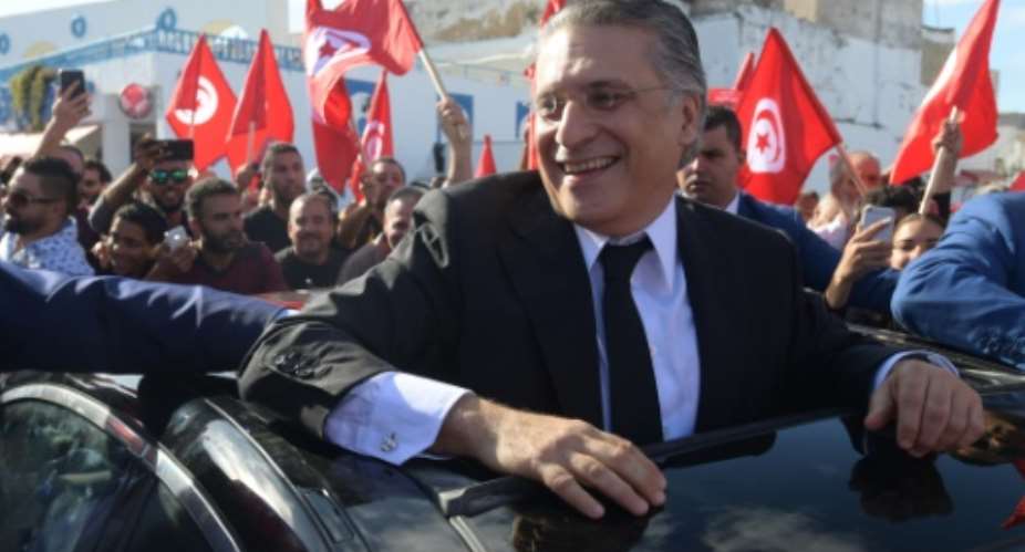 Tunisian presidential candidate Nabil Karoui meets his supporters in the northern city of Bizerte on October 11, 2019 two days before a runoff vote pitting him against independent conservative academic Kais Saied.  By FETHI BELAID AFP