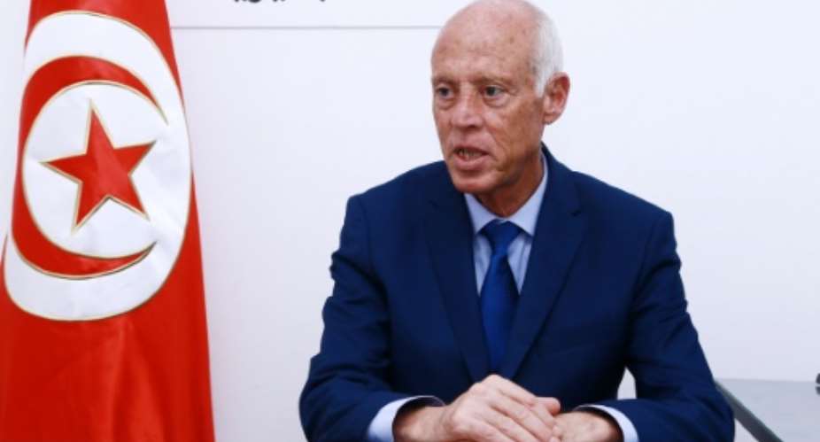 Tunisian presidential frontrunner Kais Saied quits campaigning ahead of the October 13 run-off vote saying he wants to avoid an unfair advantage over his jailed opponent business tycoon Nabil Karoui.  By ANIS MILI AFPFile
