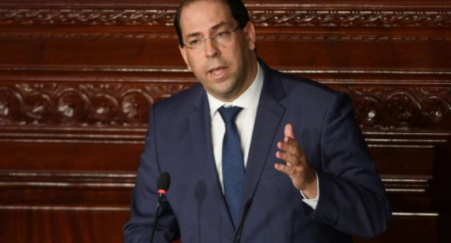 Tunisian Prime Minister Youssef Chahed gives a speech prior to a confidence bill during a plenary session of  parliament on July 28, 2018.  By FETHI BELAID AFPFile