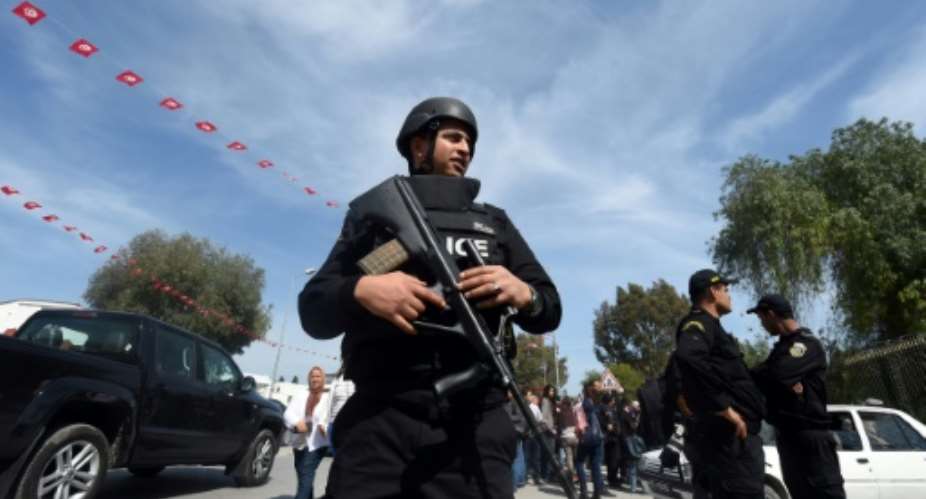 Tunisian security forces stand guard near the National Bardo Museum in Tunis on March 19, 2015.  By FETHI BELAID AFPFile