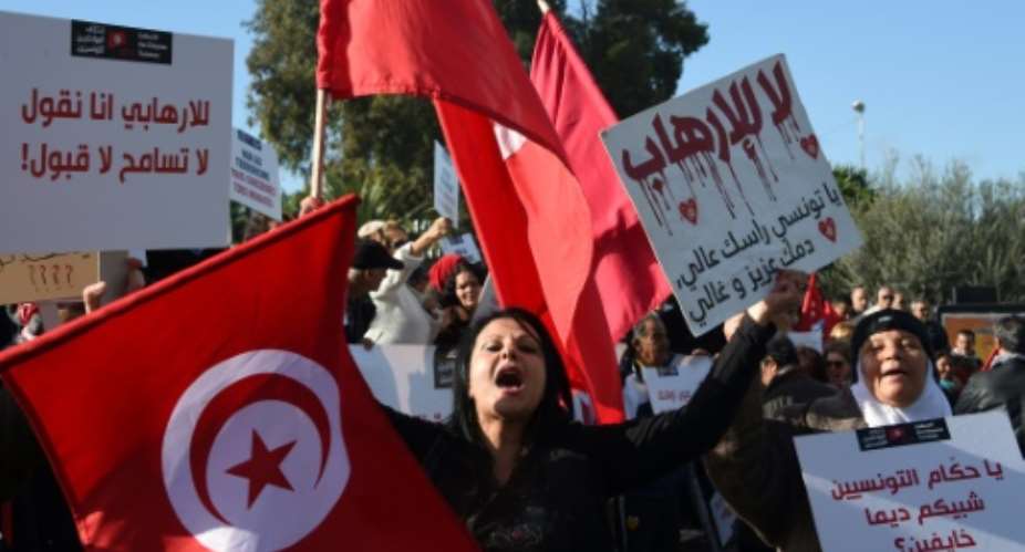 Tunisian women shout slogans during a demonstration outside parliament against allowing Tunisians who joined the ranks of jihadist groups to return to the country, in the capital Tunis on December 24, 2016.  By FETHI BELAID AFP