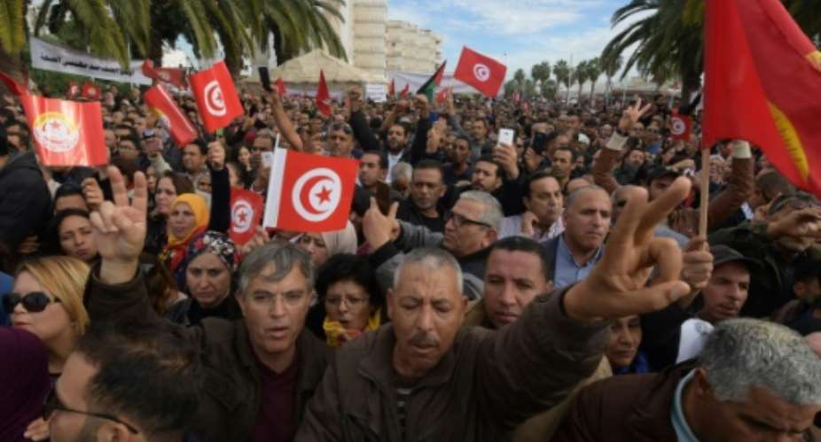 Tunisians protest in the capital Tunis during a general strike by civil servants on November 22, 2018.  By FETHI BELAID AFP