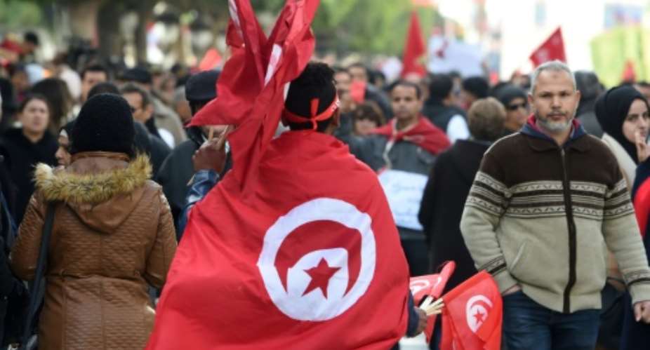 Tunisians rally in  Tunis to mark the eighth anniversary of the 2011 revolution that toppled their longtime dictator on January 14, 2019.  By Fethi Belaid AFP