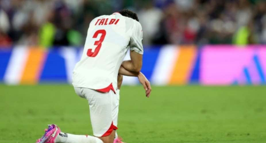 Tunisias dejected players have already been knocked out of the World Cup after conceding nine goals in two matches.  By Julio Cesar AGUILAR (AFP)