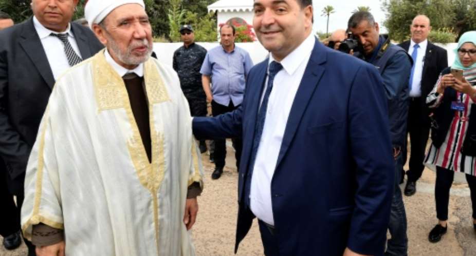 Tunisia's new tourism minister Rene Trabelsi R meets the country's Grand Mufti Othman Battikh at the Ghriba Synagogue on Djerba island on May 02, 2018.  By FETHI BELAID AFPFile