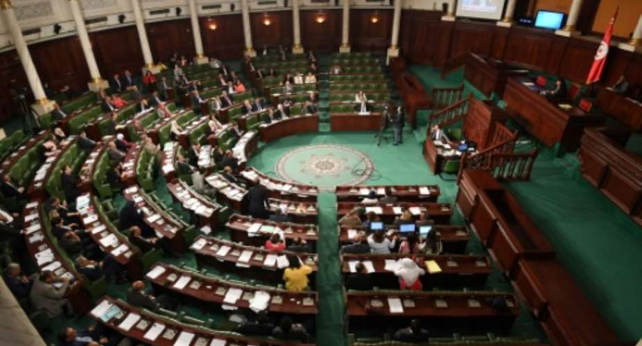 Tunisia's parliament voted to ease the country's harsh drug law to allow first-time offenders, mostly users of cannabis, to avoid jail.  By FETHI BELAID AFP