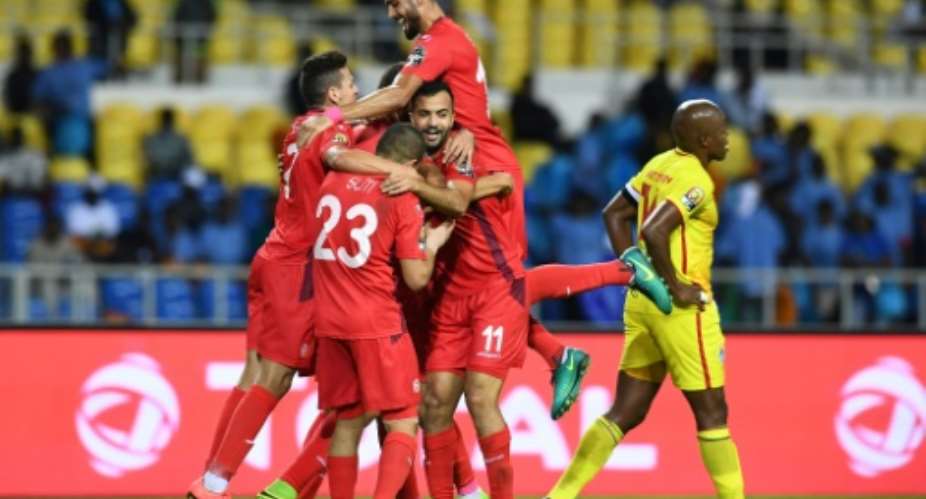 Tunisia's players celebrate a goal during the 2017 Africa Cup of Nations group A football match against Zimbabwe in Libreville on January 23, 2017.  By GABRIEL BOUYS AFP