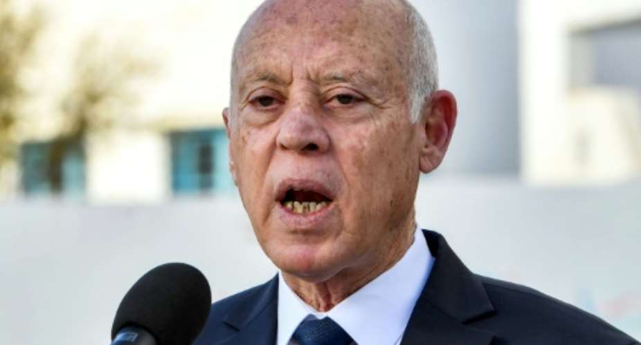 Tunisias President Kais Saied speaks to reporters after voting in the 2023 local elections.  By FETHI BELAID (AFP)