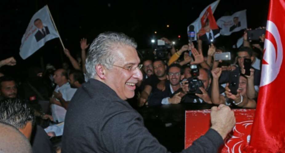 Tunisia's presidential candidate Nabil Karoui is greeted by his supporters after being released from Mornaguia prison near the capital Tunis ahead of Sunday's runoff.  By ANIS MILI AFP