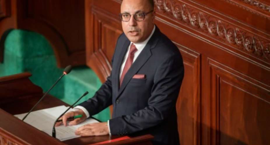 Tunisia's prime minister-designate Hichem Mechichi delivers a speech as parliament readies for a confidence vote.  By Fethi Belaid AFP
