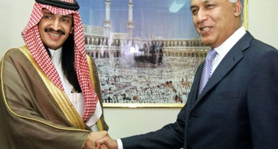 Turki bin Bandar bin Mohamed bin Abderrahmane al-Saud shakes hands with Pakistan's Finance Minister Shaukat Aziz in Islamabad in a file picture from 15 September 2003.  By FAROOQ NAEEM AFP