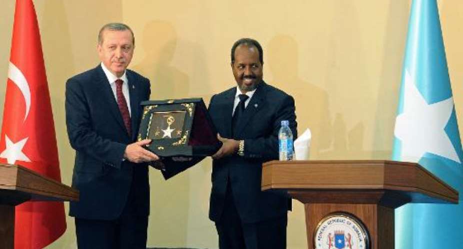 Turkish President Recep Tayyip Erdogan L with Somalia President Hassan Sheik Mohamud, in Mogadishu, on January 25, 2015.  By Mohamed Abdiwahab AFP