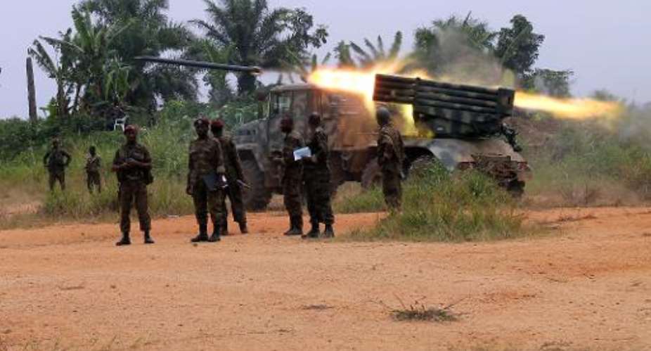 DR Congo troops launch a missile during a fight against Islamist rebels, near Kokola, in the east of the country.  By Alain Wandimoyi AFPFile