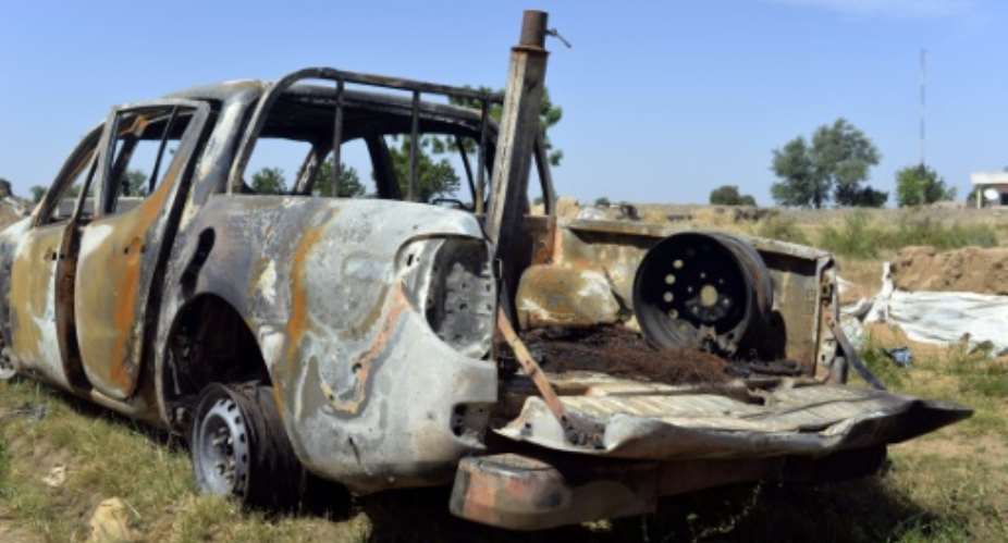A Boko Haram vehicle destroyed during an attack on a Cameroon military base on October 15, 2014.  By Reinnier Kaze AFPFile