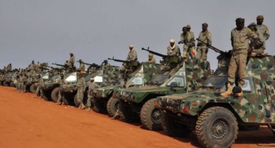 Chadian soldiers prepare to leave a military camp on the outskirts of Niamey on January 24, 2013, on their way to Mali.  By Boureima Hama (AFP/File)