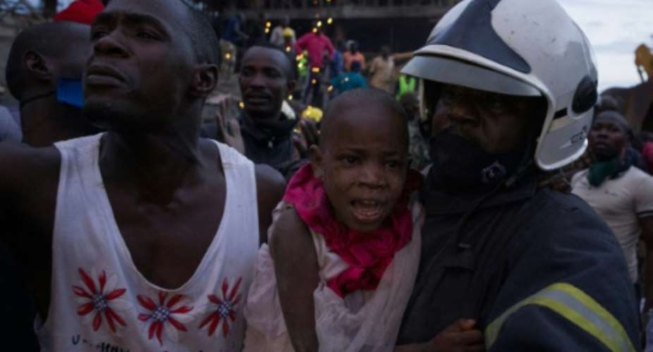 Two girls aged five and nine were found alive and taken to Kampala's main hospital.  By KATUMBA BADRU SULTAN AFP