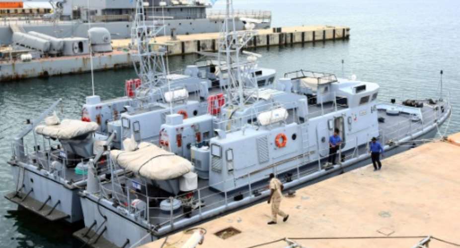 Two of the four Libyan Coast Guard ships are docked in the harbour of the capital Tripoli, following their return after undergoing maintenance in Italy on May 15, 2017.  By MAHMUD TURKIA AFP
