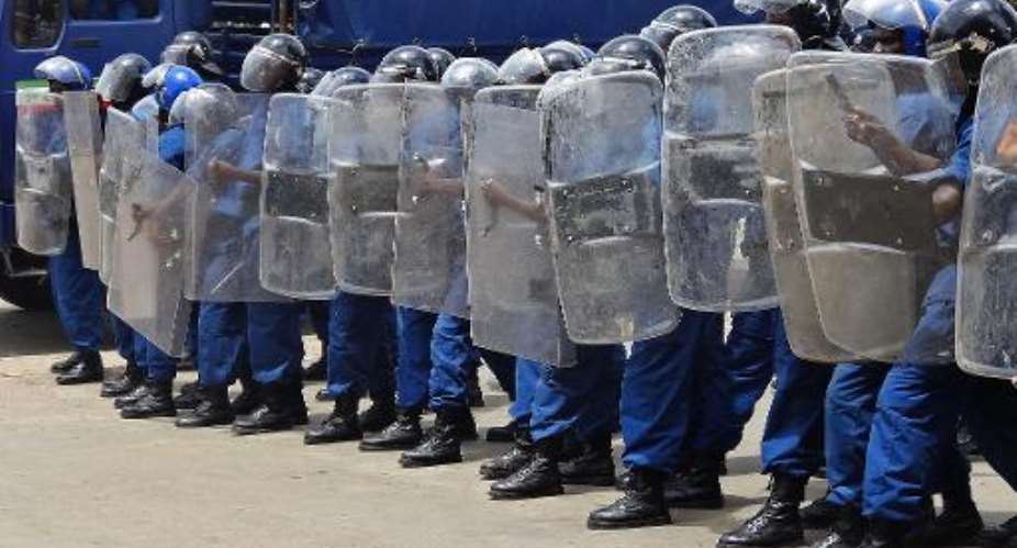 Burundi police form a blockade during a gathering of opposition activists in Bujumbura on April 17, 2015.  By Esdras Ndikumana AFPFile