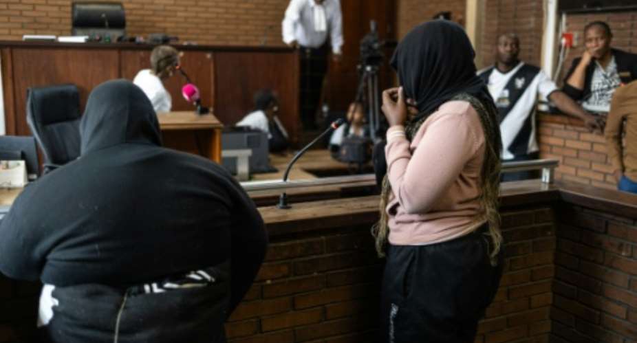 Two women appeared in court over the killing of Kempton Parks ninth victim.  By EMMANUEL CROSET (AFP)