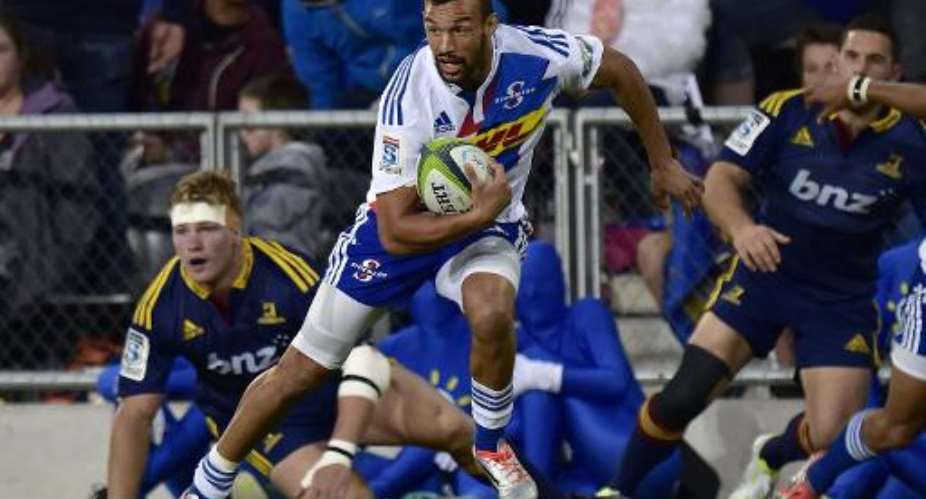 Stormers' Dillyn Leyds looks to pass the ball during the Super 15 Rugby Union match against the Highlanders in Dunedin on March 28, 2015.  By Marty Melville AFPFile