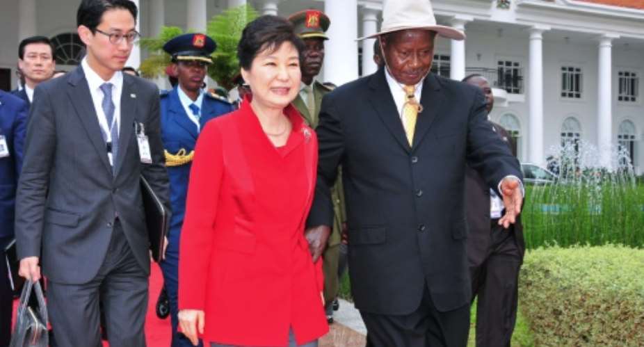 During a summit with visiting South Korean President Park Geun-Hye C, Uganda's President Yoweri Museveni R said he had ordered officials faithfully to honour the latest UN sanctions, a Seoul official said.  By Peter Busomoke AFP
