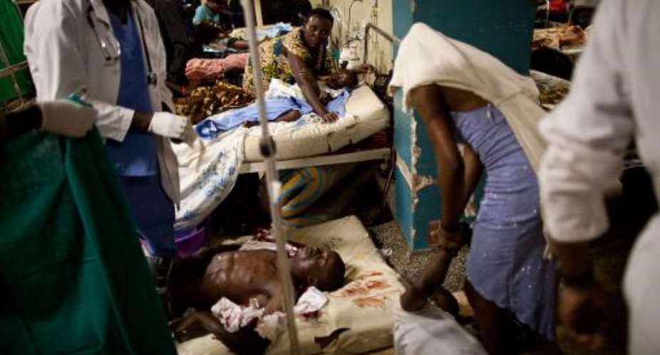 Ugandan doctors treat victims at Mulago hospital in Kampala in Kampala on July 11, 2010.  By Trevor Snapp AFPFile