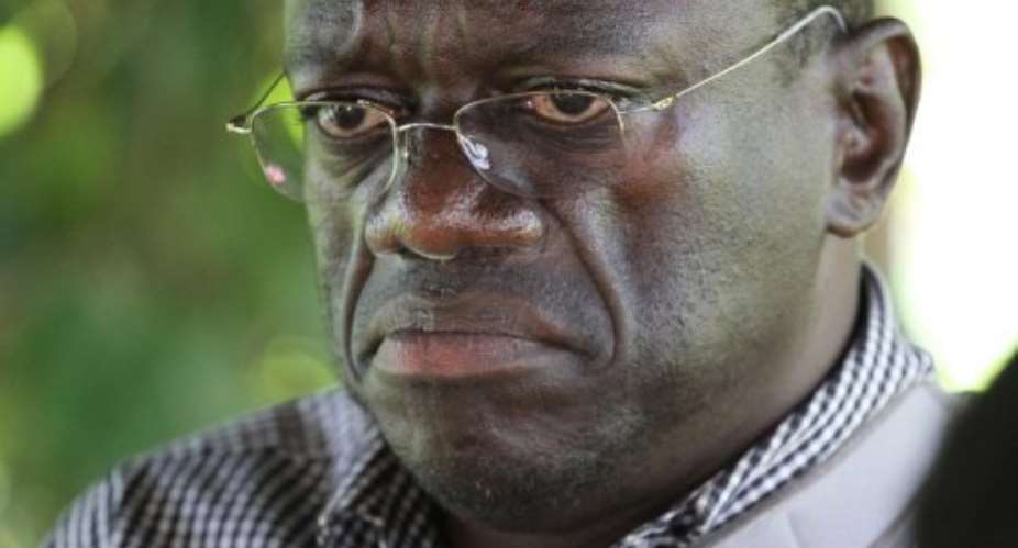 Kizza Besigye was arrested as he set off from his home on a protest walk.  By Marc Hofer (AFP)