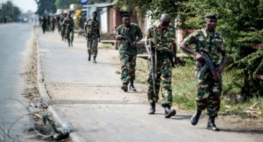 Burundian soldiers withdrawing from the restive Cibitoke neighbourhood in Bujumbura after a police operation during the celebrations of the country's 53rd Independence Anniversary on July 1, 2015.  By Marco Longari AFPFile