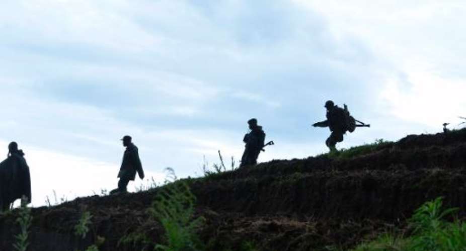 Democratic Republic of Congo soldiers advance on November 5, 2013 near Chanzu, 80 kilometres north of regional capital Goma.  By Junior D. Kannah AFPFile