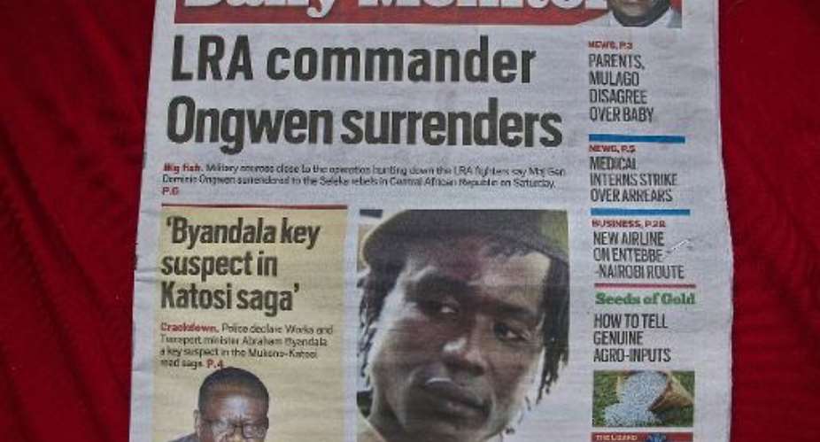 A Ugandan daily in Kampala carries a picture of former Lord's Resistance Army LRA second-in-command Dominic Ongwen on January 7, 2015.  By Isaac Kasamani AFPFile