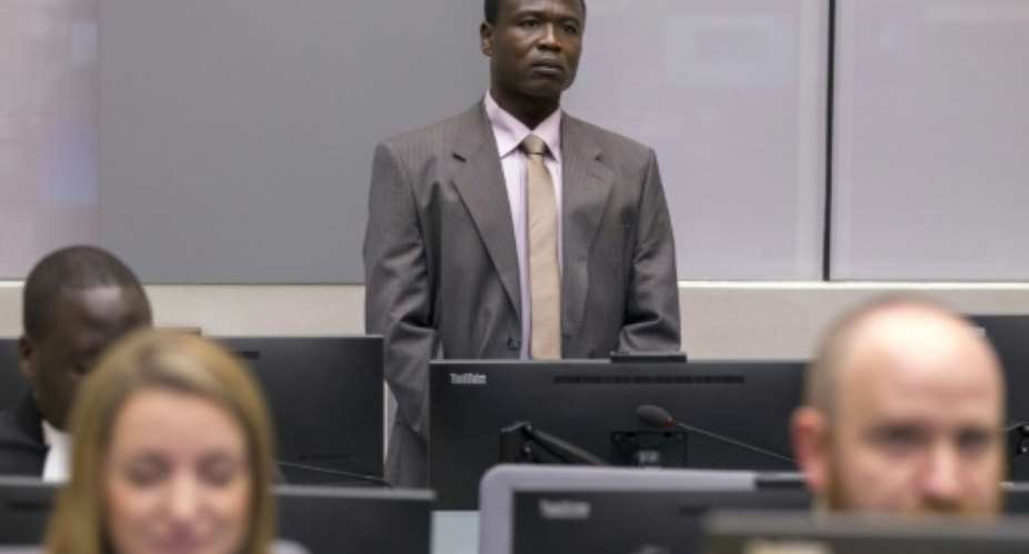 Ugandan commander of the Lord's Resistance Army LRA Dominic Ongwen, stands in the courtroom of the International Criminal Court ICC during the confirmation of charges hearing in the Hague on January 21, 2016.  By Michael Kooren ANPAFPFile