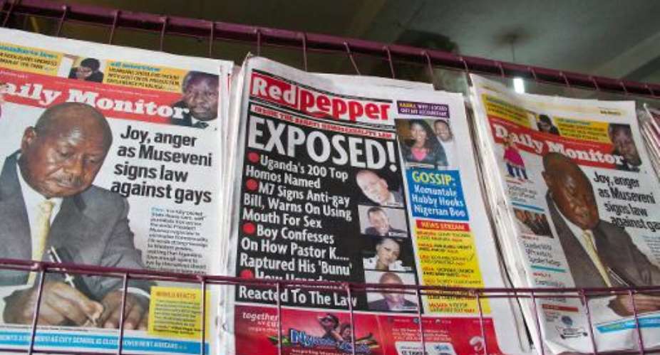 A newspaper stand in Kampala displays Uganda's local dailies on February 25, 2014, a day after the president signed a tough new anti-gay law.  By Isaac Kasamani AFP