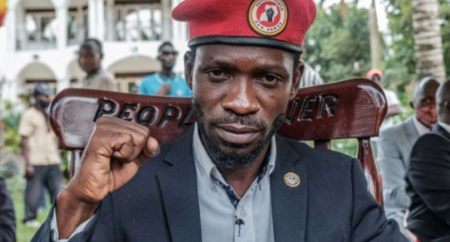 Ugandan opposition leader Robert Kyagulanyi, also known as Bobi Wine, poses for a photograph after his press conference at his home on Tuesday.  By SUMY SADURNI AFP