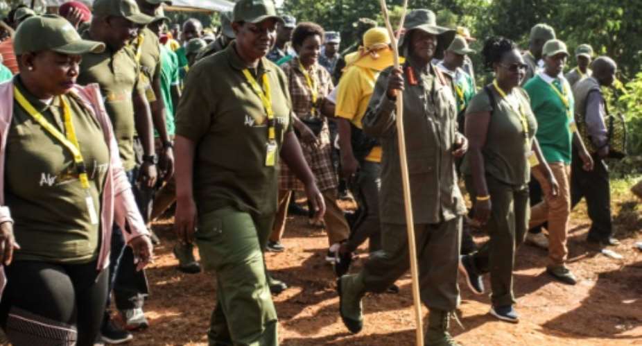 Ugandan President Yoweri Museveni and veterans and Members of Parliament, march through the jungle as he retraces the route which his guerrilla forces took 35 years ago.  By Hajarah Nalwadda AFP