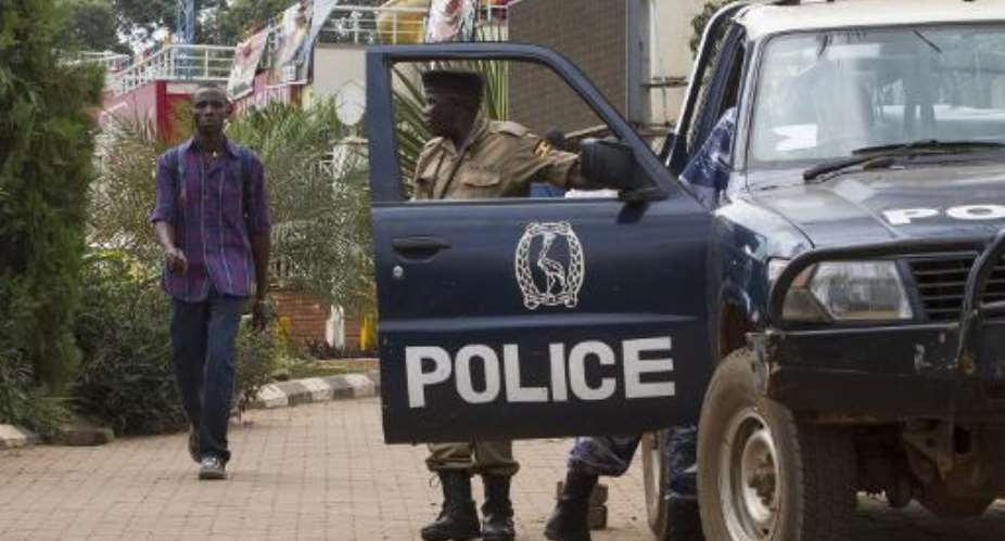 Ugandan police stand guard in the capital Kampala on September 14, 2014.  By Isaac Kasamani AFPFile
