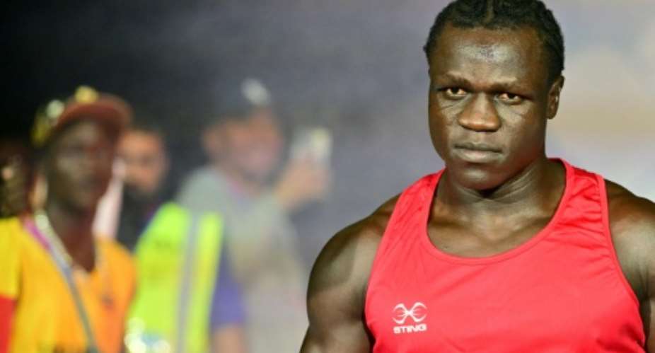 Ugandas Aziz Abdul, grandson of Idi Amin, was disqualified from his Commonwealth Games boxing bout.  By ANDY BUCHANAN (AFP)