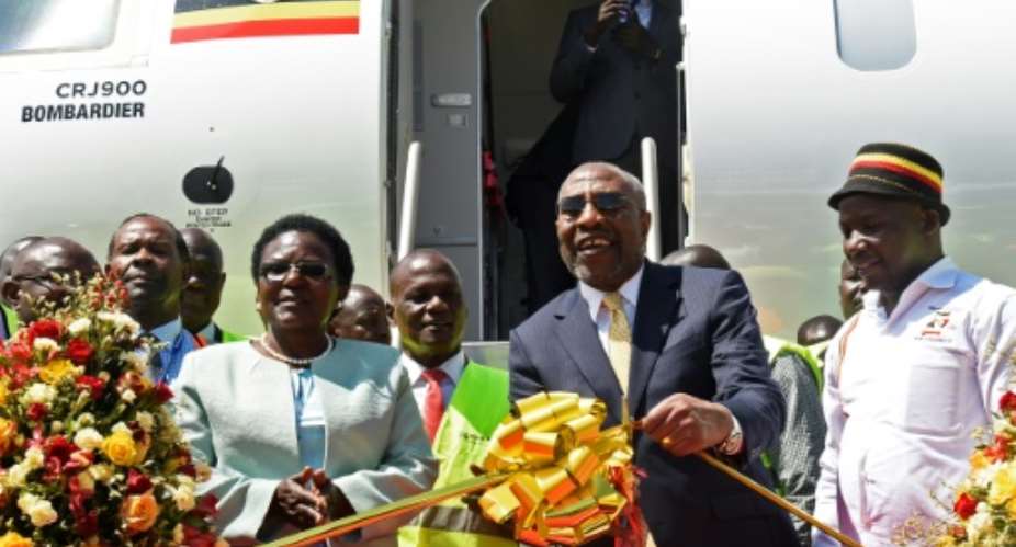 Ugandas Prime Minister Ruhakana Rugunda and Transport Minister Monica Azuba both attended the relaunch of the airline ahead of an inaugural flight from Entebbe International Airport to Nairobi.  By ISAAC KASAMANI AFP