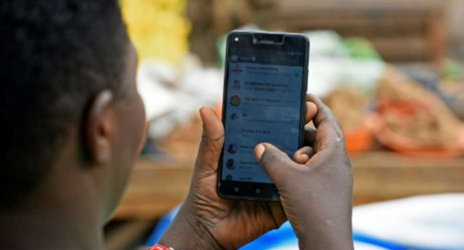 Uganda's tax on social media has run into angry opposition from users.  By Isaac Kasamani AFP