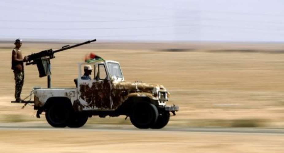 Libyas National Transitional Council forces found raw uranium at two big warehouses.  By Joseph Eid (AFP)