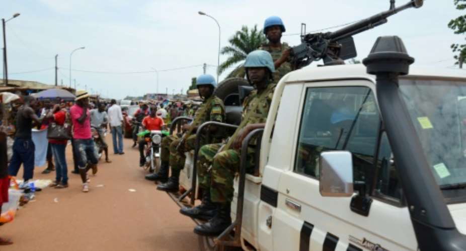 UN Peacekeeping troops patrol the main market at Kilometre Five in Bangui on May 18, 2015, Central African Republic.  By Patrick Fort AFPFile